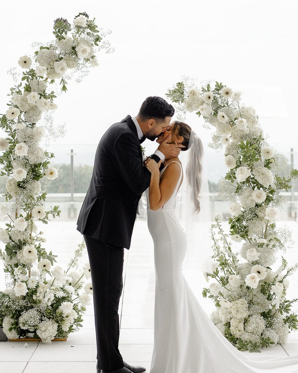 A couple kissing at their wedding